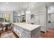 Open-concept kitchen and dining area with large island and stainless steel appliances at 2704 Castle Brook Dr, Castle Rock, CO 80108