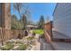Inviting backyard with patio area, rock garden, and mature landscaping for outdoor enjoyment at 7926 S Corona Ct, Centennial, CO 80122