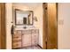 Well-appointed bathroom featuring granite countertop and ample cabinet space, ideal for a serene experience at 7926 S Corona Ct, Centennial, CO 80122