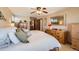 Comfortable bedroom with ceiling fan, with mirror, and dresser, providing a relaxing personal space at 7926 S Corona Ct, Centennial, CO 80122