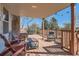 Relaxing covered deck featuring comfortable seating and string lights for outdoor enjoyment at 7926 S Corona Ct, Centennial, CO 80122
