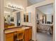 Bathroom with vanity, sink and view into the bedroom at 6460 W 98Th Ct, Westminster, CO 80021