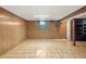Spacious basement with wood paneled walls and hard wood floors at 2683 E 90Th Pl, Thornton, CO 80229