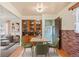 This dining area features hardwood floors, a built-in hutch, and ample space for gathering and enjoying meals at 2683 E 90Th Pl, Thornton, CO 80229
