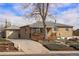 Charming brick home with a covered front porch, mature tree, and detached garage offers curb appeal and functionality at 2683 E 90Th Pl, Thornton, CO 80229
