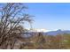Scenic view showcasing snow-capped mountains and lush trees, providing a serene backdrop at 2683 E 90Th Pl, Thornton, CO 80229