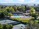 Aerial view of neighborhood pool, tennis courts and clubhouse at 5884 S Hanover Way, Greenwood Village, CO 80111