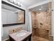Bathroom featuring a tiled shower and large vanity at 5884 S Hanover Way, Greenwood Village, CO 80111