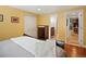 Bright bedroom with hardwood floors, complemented by a closet and access to the bathroom at 5884 S Hanover Way, Greenwood Village, CO 80111