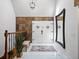 Elegant foyer featuring marble floors, a patterned rug, double front doors, and natural light at 5884 S Hanover Way, Greenwood Village, CO 80111