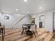 Spacious game room featuring a poker table and stairs at 5884 S Hanover Way, Greenwood Village, CO 80111