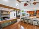 Kitchen with granite countertops, stainless steel appliances, breakfast bar, and an open layout at 5884 S Hanover Way, Greenwood Village, CO 80111