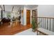 Open-concept living space with hardwood floors and a view of the adjacent dining room at 5884 S Hanover Way, Greenwood Village, CO 80111