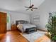 Bright main bedroom with hardwood floors and a ceiling fan at 5884 S Hanover Way, Greenwood Village, CO 80111