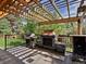 Outdoor patio area featuring a fireplace and grill, perfect for outdoor gatherings at 5884 S Hanover Way, Greenwood Village, CO 80111