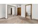 Bedroom features a large closet with mirrored doors and an attached bathroom at 26063 Morris Ave, Conifer, CO 80433
