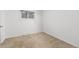 Bedroom with carpet, baseboard heating, and a single window with views of the outside at 26063 Morris Ave, Conifer, CO 80433