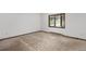 Bedroom with neutral carpet, and a large window bringing in natural light at 26063 Morris Ave, Conifer, CO 80433