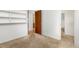 Neutral bedroom featuring closet with built-in shelving and plush carpet at 26063 Morris Ave, Conifer, CO 80433