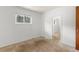 Cozy bedroom featuring a window and white trim throughout for a clean aesthetic at 26063 Morris Ave, Conifer, CO 80433