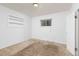 Bedroom with natural light, featuring a window and a built-in bookshelf at 26063 Morris Ave, Conifer, CO 80433