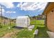 Backyard with a greenhouse for cultivating plants, offering privacy at 26063 Morris Ave, Conifer, CO 80433