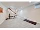 Spacious finished basement area that includes workout equipment and natural light at 7100 S Hudson Cir, Centennial, CO 80122