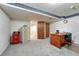 Finished basement area featuring office space and storage cabinets at 7100 S Hudson Cir, Centennial, CO 80122