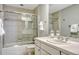 Elegant bathroom with a shower, tub combination with glass doors and white cabinets at 7100 S Hudson Cir, Centennial, CO 80122
