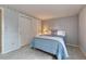 Comfortable bedroom features a cozy bed with grey carpet and an oversized closet at 7100 S Hudson Cir, Centennial, CO 80122