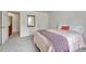 Bedroom featuring soft carpet, a bed with a colorful blanket, and a closet at 7100 S Hudson Cir, Centennial, CO 80122