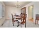 Traditional dining room with elegant chandelier, wooden table, and upholstered chairs at 7100 S Hudson Cir, Centennial, CO 80122