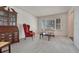 Cozy living room with plush carpet, a window with bright, natural light, and classic furniture at 7100 S Hudson Cir, Centennial, CO 80122