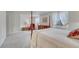 Spacious bedroom with plush carpet, four-poster bed, and windows with elegant drapery at 7100 S Hudson Cir, Centennial, CO 80122