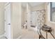 Clean bathroom with tiled floors and a shower-tub combo at 814 Neville Ln, Golden, CO 80401