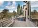 Spacious outdoor deck featuring patio furniture, an umbrella, and scenic views of the surrounding landscape at 814 Neville Ln, Golden, CO 80401