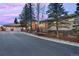 An inviting home exterior features a three-car garage and stone accents at 814 Neville Ln, Golden, CO 80401