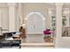 Elegant foyer with piano, arched doorway, and stylish furnishings at 814 Neville Ln, Golden, CO 80401