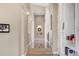 Bright, neutral hallway with hardwood floors and subtle wall decor leading to the bedrooms at 814 Neville Ln, Golden, CO 80401