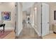 View of a long hallway with marble floors, columns, and doorways at 814 Neville Ln, Golden, CO 80401