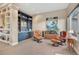 Comfortable sitting room featuring a built-in bar and shelving, complemented by leather chairs and a calming ambiance at 814 Neville Ln, Golden, CO 80401