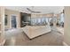 Bright living room with floor to ceiling windows, a fireplace, and a comfortable sectional sofa at 814 Neville Ln, Golden, CO 80401