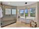 Luxurious main bathroom featuring a soaking tub, stylish shower, and mountain views at 814 Neville Ln, Golden, CO 80401