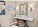 Stylish powder room with designer mirror, elegant lighting, and unique vanity at 814 Neville Ln, Golden, CO 80401