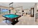 A recreation room featuring a pool table, large windows, and an open floor plan at 814 Neville Ln, Golden, CO 80401