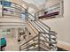Grand staircase with unique railing design, offering views of the living room and lower level at 814 Neville Ln, Golden, CO 80401