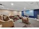 A cozy theater room with comfortable seating and a large projector screen for entertainment at 814 Neville Ln, Golden, CO 80401