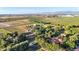 Expansive aerial view showcasing the property's size and surrounding landscape at 10876 Maple Rd, Lafayette, CO 80026