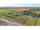 Aerial view of a spacious property with farmlands, and residential areas at 10876 Maple Rd, Lafayette, CO 80026