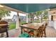 Relaxing back porch with table and chairs, overlooking the farm at 10876 Maple Rd, Lafayette, CO 80026